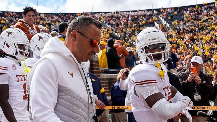 Texas head coach Steve Sarkisian and the Texas players take the field for warm-up at Michigan Stadium in Ann Arbor on Saturday, September 7, 2024.