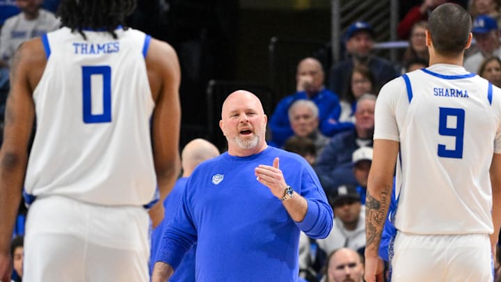 Feb 7, 2026; St. Louis, Missouri, USA;  Saint Louis Billikens head coach Josh Schertz talks with forward Ishan Sharma (9) during a time out in the first half against the La Salle Explorers at Chaifetz Arena. Mandatory Credit: Jeff Curry-Imagn Images