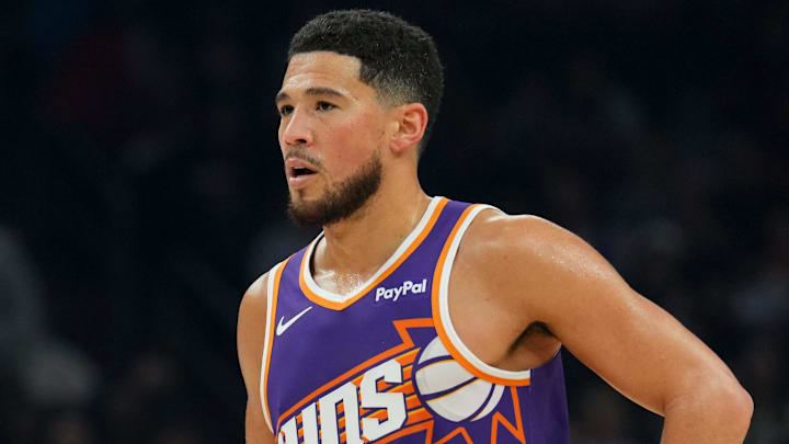 Jan 2, 2026; Phoenix, Arizona, USA; Phoenix Suns guard Devin Booker (1) looks on against the Sacramento Kings during the first half at Mortgage Matchup Center. Mandatory Credit: Joe Camporeale-Imagn Images
