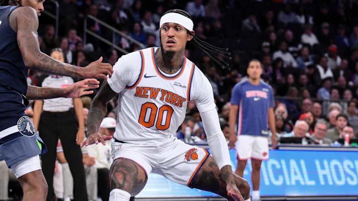 Oct 9, 2025; New York, New York, USA; New York Knicks guard Jordan Clarkson (00) drives to the basket while defended by Minnesota Timberwolves guard Bones Hyland (8) during the second half at Madison Square Garden. Mandatory Credit: John Jones-Imagn Images