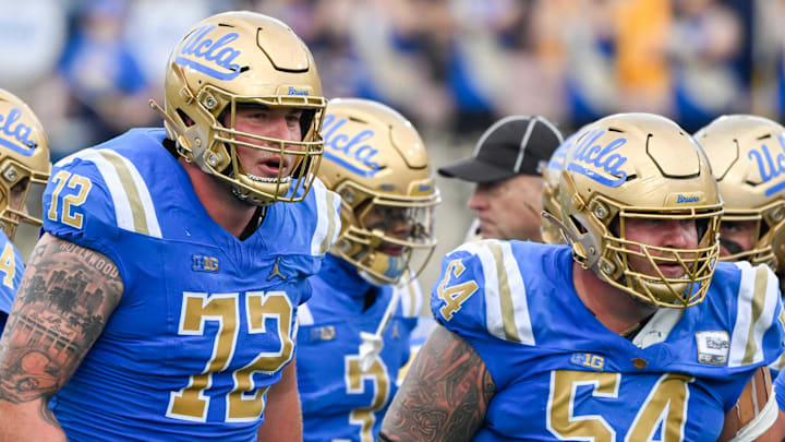 Nov 30, 2024; Pasadena, California, USA; UCLA Bruins offensive linemen Garrett DiGiorgio (72) and Josh Carlin (54) during the second quarter against the Fresno State Bulldogs at Rose Bowl. Mandatory Credit: Robert Hanashiro-Imagn Images
