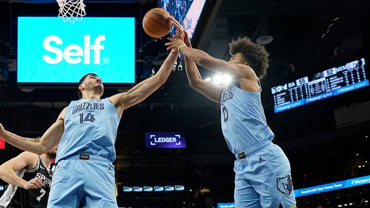 Dec 2, 2025; San Antonio, Texas, USA; Memphis Grizzlies center Zach Edey (14) and guard Jaylen Wells (0) reach for a rebound during the first half against the San Antonio Spurs at Frost Bank Center. Mandatory Credit: Scott Wachter-Imagn Images Dec 2, 2025; San Antonio, Texas, USA; Memphis Grizzlies center Zach Edey (14) and guard Jaylen Wells (0) reach for a rebound during the first half against the San Antonio Spurs at Frost Bank Center. Mandatory Credit: Scott Wachter-Imagn Images