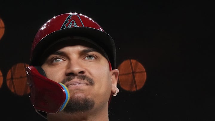 Arizona Diamondbacks Josh Naylor (22) spits as he reacts to fouling off a pitch against the San Diego Padres at Chase Field.