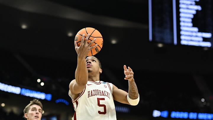 Mar 19, 2026; Portland, OR, USA; Arkansas Razorbacks guard Darius Acuff Jr. (5) drives against Hawaii Rainbow Warriors forward Harry Rouhliadeff (14) in the first half during a first round game of the men's 2026 NCAA Tournament at Moda Center. Mandatory Credit: Troy Wayrynen-Imagn Images Mar 19, 2026; Portland, OR, USA; Arkansas Razorbacks guard Darius Acuff Jr. (5) drives against Hawaii Rainbow Warriors forward Harry Rouhliadeff (14) in the first half during a first round game of the men's 2026 NCAA Tournament at Moda Center. Mandatory Credit: Troy Wayrynen-Imagn Images