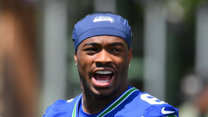 Seattle Seahawks quarterback Jalen Milroe laughs during minicamp