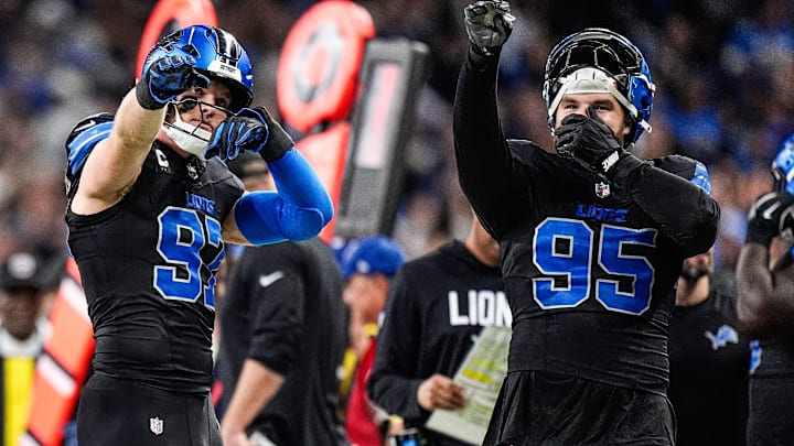 From left, Detroit Lions defensive tackle Roy Lopez (51), defensive end Aidan Hutchinson (97), and defensive end Pat O'Connor (95) react to a reverse call after referees’ second review during the second half at Ford Field in Detroit on Monday, Oct. 20, 2025.