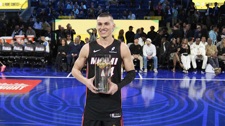 Feb 15, 2025; San Francisco, CA, USA; Miami Heat guard Tyler Herro (14) celebrates with the trophy after winning the three-point contest during All Star Saturday Night ahead of the 2025 NBA All Star Game at Chase Center. Mandatory Credit: Kyle Terada-Imagn Images