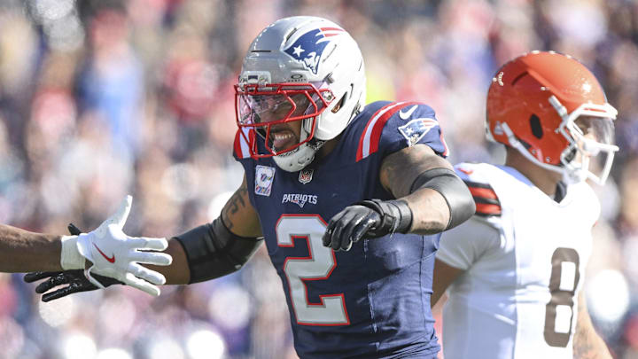 Oct 26, 2025; Foxborough, Massachusetts, USA;  New England Patriots safety Jaylinn Hawkins (21) reacts with linebacker Harold Landry III (2) after making a sack during the first quarter against the Cleveland Browns at Gillette Stadium. Mandatory Credit: Brian Fluharty-Imagn Images