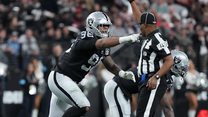 Dec 16, 2024; Paradise, Nevada, USA; Las Vegas Raiders defensive tackle Jonah Laulu (96) celebrates after sacking Atlanta Falcons quarterback Kirk Cousins (18) in the first half at Allegiant Stadium. Mandatory Credit: Kirby Lee-Imagn Images Dec 16, 2024; Paradise, Nevada, USA; Las Vegas Raiders defensive tackle Jonah Laulu (96) celebrates after sacking Atlanta Falcons quarterback Kirk Cousins (18) in the first half at Allegiant Stadium. Mandatory Credit: Kirby Lee-Imagn Images