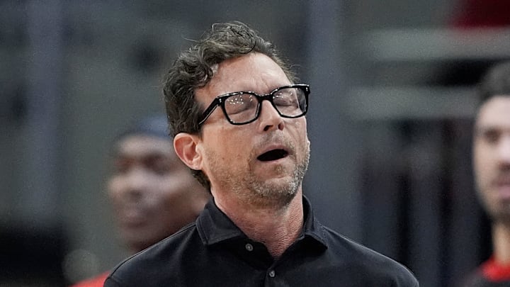 Quin Snyder quietly expresses his frustration during a game against the Milwaukee Bucks