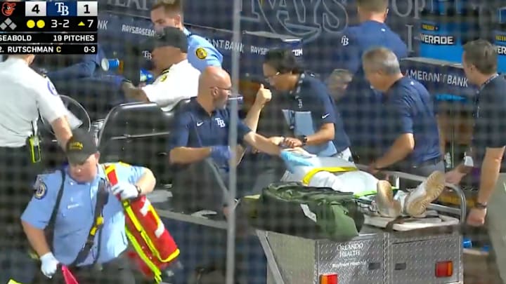 Hunter Bigge gives fans a thumbs up as he leaves game on stretcher. 