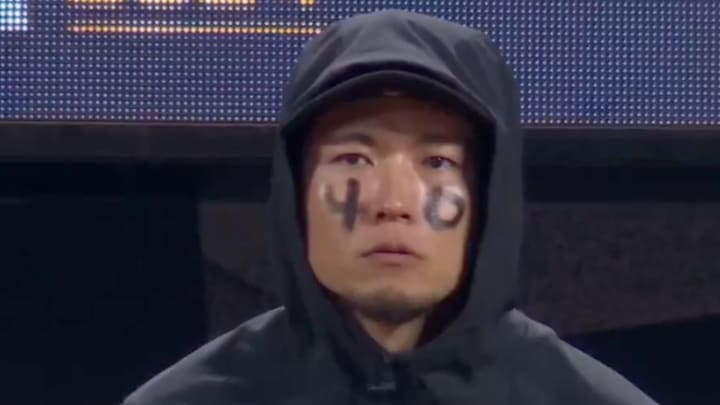 Kodai Senga in the New York Mets dugout during NLCS Game 3 against the Los Angeles Dodgers