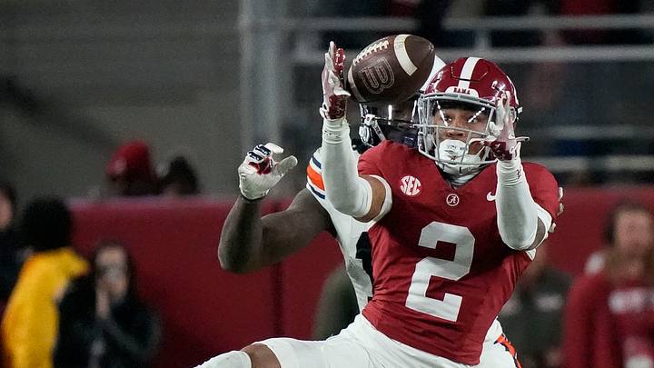 Nov 30, 2024; Tuscaloosa, Alabama, USA; Alabama Crimson Tide defensive back Zabien Brown (2) intercepts a pass intended for Auburn Tigers tight end Rivaldo Fairweather (13) during second half at Bryant-Denny Stadium. Alabama won 28-14. Mandatory Credit: Gary Cosby Jr.-Imagn Images Nov 30, 2024; Tuscaloosa, Alabama, USA; Alabama Crimson Tide defensive back Zabien Brown (2) intercepts a pass intended for Auburn Tigers tight end Rivaldo Fairweather (13) during second half at Bryant-Denny Stadium. Alabama won 28-14. Mandatory Credit: Gary Cosby Jr.-Imagn Images