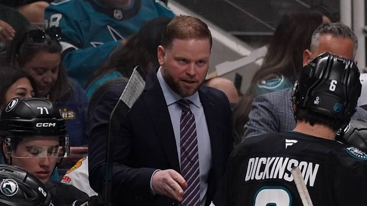 Apr 6, 2026; San Jose, California, USA;  San Jose Sharks head coach Ryan Warsofsky talks with the team during a break in the action against the Chicago Blackhawks in the first period at SAP Center at San Jose. Mandatory Credit: David Gonzales-Imagn Images