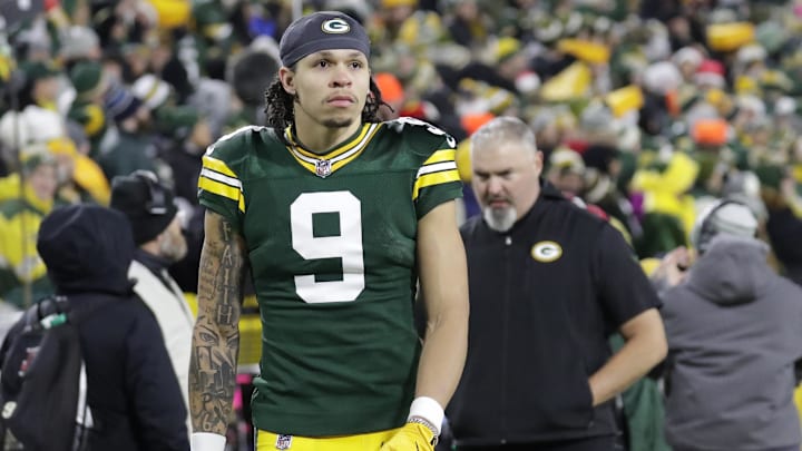 Dec 23, 2024; Green Bay, Wisconsin, USA;  Green Bay Packers wide receiver Christian Watson (9) leaves the field in the fourth quarter after getting injured against the New Orleans Saints at Lambeau Field. Mandatory Credit: Dan Powers-USA TODAY NETWORK/Imagn Images