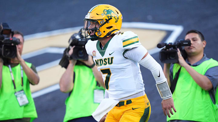 North Dakota State Bison quarterback Cam Miller (7) celebrates a rushing touchdown against Colorado, on Aug. 29, 2024, at Folsom Field.
