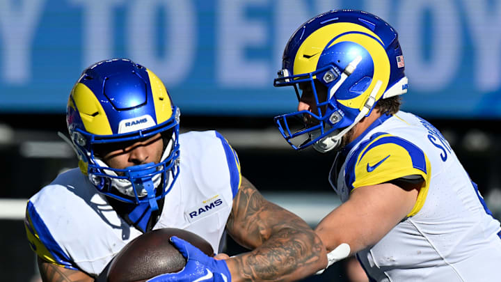 Nov 17, 2024; Foxborough, Massachusetts, USA;  Los Angeles Rams quarterback Matthew Stafford (9) hands the ball to running back Kyren Williams (23) during the first half against the New England Patriots at Gillette Stadium. Mandatory Credit: Eric Canha-Imagn Images