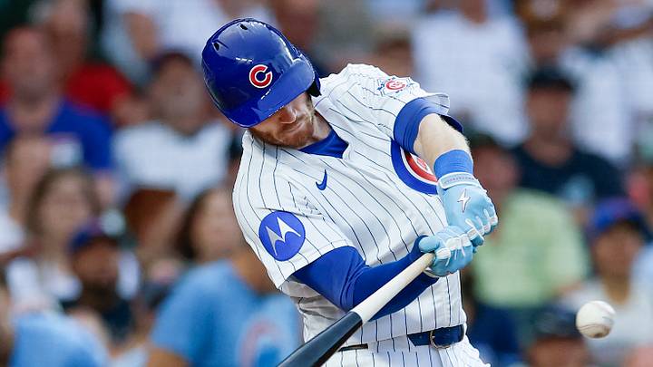 Chicago Cubs left fielder Ian Happ (8) hits an RBI-single