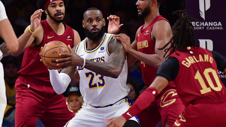 Apr 6, 2024; Los Angeles, California, USA; Los Angeles Lakers forward LeBron James (23) controls the ball against Cleveland Cavaliers center Jarrett Allen (31) forward Evan Mobley (4) and guard Darius Garland (10) during the first half at Crypto.com Arena. Mandatory Credit: Gary A. Vasquez-Imagn Images Apr 6, 2024; Los Angeles, California, USA; Los Angeles Lakers forward LeBron James (23) controls the ball against Cleveland Cavaliers center Jarrett Allen (31) forward Evan Mobley (4) and guard Darius Garland (10) during the first half at Crypto.com Arena. Mandatory Credit: Gary A. Vasquez-Imagn Images