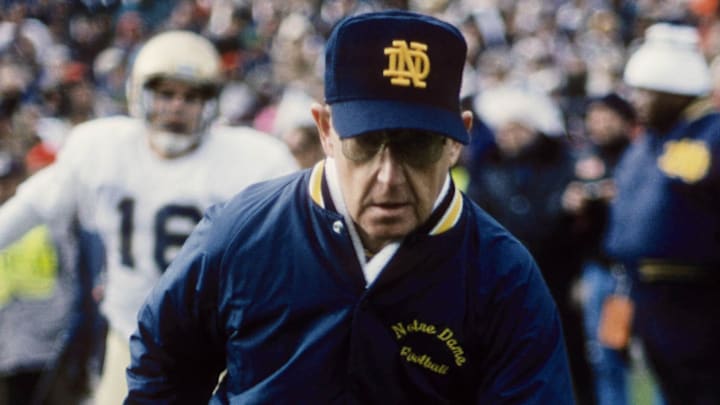 Nov 18, 1989; State College, PA, USA; FILE PHOTO; Notre Dame Fighting Irish head coach Lou Holtz walking off the following the game against the Penn State Nittany Lions at Beaver Stadium. 