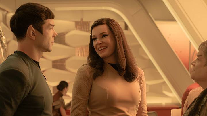 L to R Ethan Peck as Spock, Rebecca Romijn as Una and Patton Oswalt as Doug in season 3 , Episode 8 of Strange New Worlds streaming on Paramount+. Photo Credit: Marni GrossmanParamount+ L to R Ethan Peck as Spock, Rebecca Romijn as Una and Patton Oswalt as Doug in season 3 , Episode 8 of Strange New Worlds streaming on Paramount+. Photo Credit: Marni GrossmanParamount+