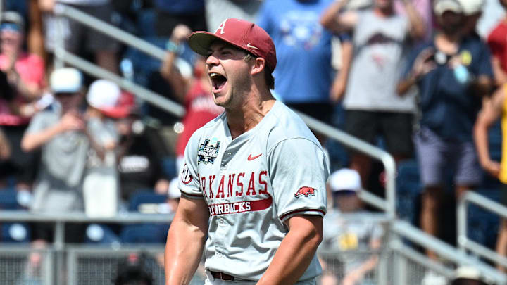 Arkansas Razorbacks starting pitcher Gage Wood celebrates completing a no-hitter in the College World Series.