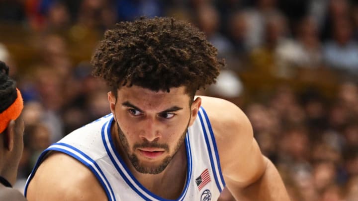 Feb 16, 2026; Durham, North Carolina, USA;  Duke Blue Devils forward Cameron Boozer (12) against Syracuse Orange forward William Kyle (42) during the during the second half at Cameron Indoor Stadium. Mandatory Credit: Zachary Taft-Imagn Images