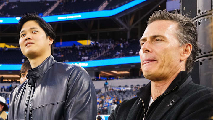Los Angeles Dodgers player Shohei Ohtani (left) and agent Nez Balelo attend the game between the Los Angeles Rams and the New Orleans Saints at SoFi Stadium on Dec. 21, 2023.
