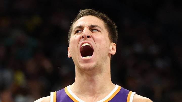 Phoenix Suns forward Royce O'Neale (00) celebrates with guard Collin Gillespie (12) against the Los Angeles Lakers in the second half at Mortgage Matchup Center on February 26, 2026.