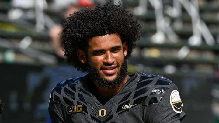 Sep 20, 2025; Eugene, Oregon, USA; Oregon Ducks quarterback Dante Moore (5) warms up before the game against the Oregon State Beavers at Autzen Stadium. Mandatory Credit: Troy Wayrynen-Imagn Images
