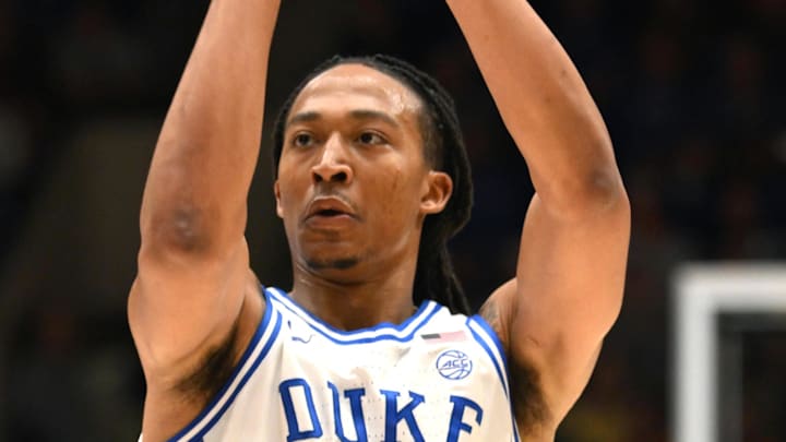 Feb 16, 2026; Durham, North Carolina, USA;  Duke Blue Devils forward Maliq Brown (6) shoots the ball against Syracuse Orange forward Sadiq White Jr. (0) during the during the second half at Cameron Indoor Stadium. Mandatory Credit: Zachary Taft-Imagn Images