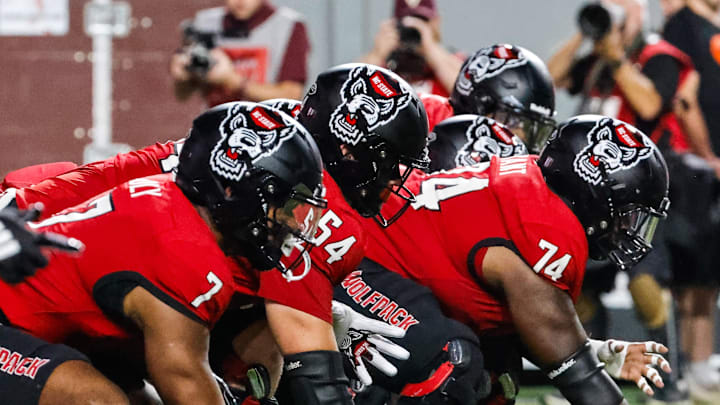 Sep 27, 2025; Raleigh, North Carolina, USA;  North Carolina State Wolfpack offensive lineman Jalen Grant (74) with the ball during the first half of the game against Virginia Tech Hokies at Carter-Finley Stadium. Mandatory Credit: Jaylynn Nash-Imagn Images