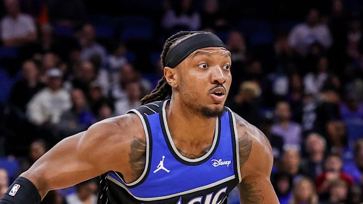 Orlando Magic center Wendell Carter Jr. handles the ball against Houston Rockets center Alperen Sengun.