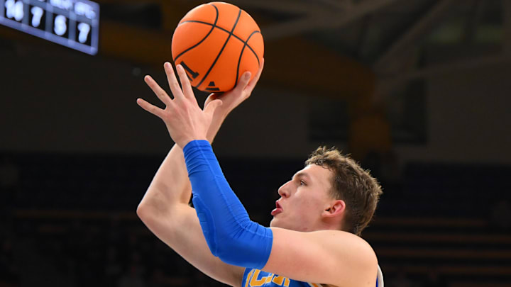 Dec 3, 2025; Seattle, Washington, USA; UCLA Bruins forward Tyler Bilodeau (34) shoots the ball against the Washington Huskies during the second half at Alaska Airlines Arena at Hec Edmundson Pavilion. Mandatory Credit: Steven Bisig-Imagn Images