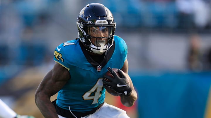 Jacksonville Jaguars running back Tank Bigsby (4) rushes for yards against New York Jets cornerback Kendall Sheffield (27) during the fourth quarter Sunday, Dec. 15, 2024 at EverBank Stadium in Jacksonville, Fla. The Jets held off the Jaguars 32-25. [Corey Perrine/Florida Times-Union]