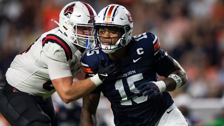 Auburn Tigers defensive end Keldric Faulk blitzes against the Ball State Cardinals at Jordan-Hare Stadium Auburn Tigers defensive end Keldric Faulk blitzes against the Ball State Cardinals at Jordan-Hare Stadium