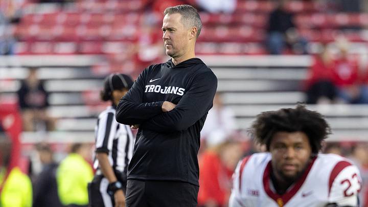 Oct 24, 2026; Madison, Wisconsin, USA; USC Trojans head coach Lincoln Riley watches his team during warmups before the game against the Wisconsin Badgers at Camp Randall Stadium. Mandatory Credit: Anthony Wahl-Imagn Images Oct 24, 2026; Madison, Wisconsin, USA; USC Trojans head coach Lincoln Riley watches his team during warmups before the game against the Wisconsin Badgers at Camp Randall Stadium. Mandatory Credit: Anthony Wahl-Imagn Images
