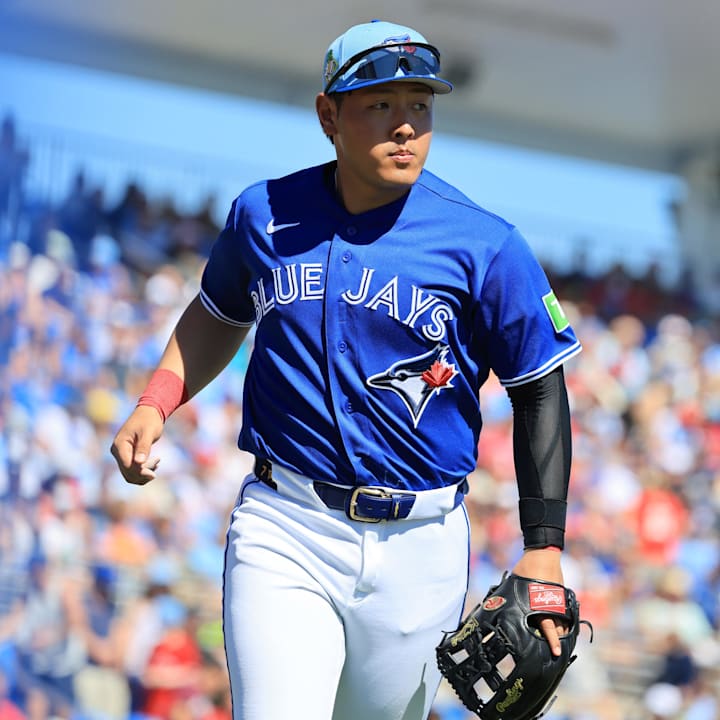 Kazuma Okamoto looks on. 