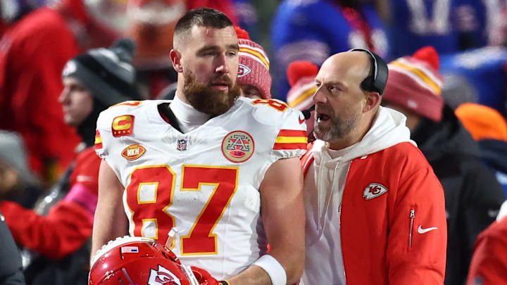 Jan 21, 2024; Orchard Park, New York, USA; Kansas City Chiefs tight end Travis Kelce (87) talks with offensive coordinator Matt Nagy during the first half for the 2024 AFC divisional round game at Highmark Stadium. Mandatory Credit: Mark J. Rebilas-Imagn Images