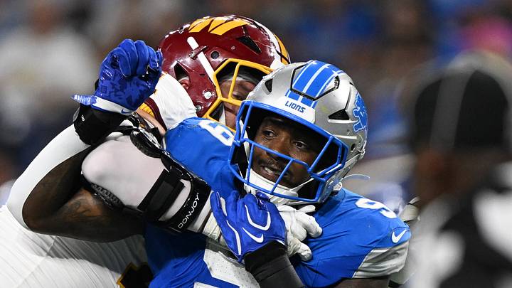 Detroit Lions rookie defensive end Derrick Moore (9) tries to pressure the quarterback against the Commanders