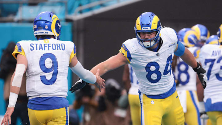Nov 30, 2025; Charlotte, North Carolina, USA; Los Angeles Rams tight end Colby Parkinson (84) celebrates with Los Angeles Rams quarterback Matthew Stafford (9) during the fourth quarter against the Carolina Panthers at Bank of America Stadium. Mandatory Credit: Scott Kinser-Imagn Images