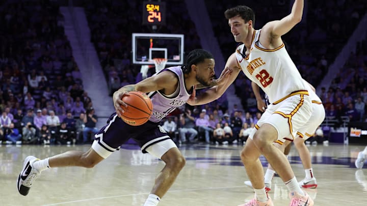 Feb 1, 2026; Manhattan, Kansas, USA; Kansas State Wildcats guard David Castillo (10) is guarded by Iowa State Cyclones forward Milan Momcilovic (22) during the first half at Bramlage Coliseum. 