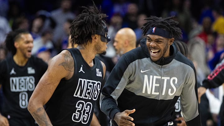 Feb 22, 2025; Philadelphia, Pennsylvania, USA; Brooklyn Nets center Nic Claxton (33) celebrates with center Day'Ron Sharpe after scoring the game-winning shot against the Philadelphia 76ers as time expired in the fourth quarter at Wells Fargo Center. Mandatory Credit: Bill Streicher-Imagn Images