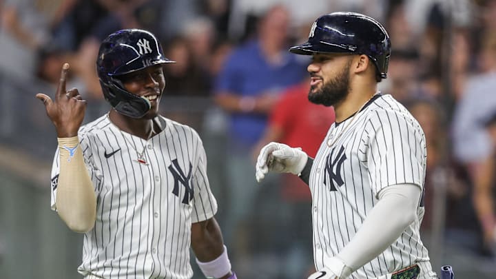 Aug 25, 2025; Bronx, New York, USA;  New York Yankees left fielder Jasson Domínguez (24) celebrates with second baseman Jazz Chisholm Jr. (13) after hitting a two run home run in the seventh inning against the Washington Nationals at Yankee Stadium. Mandatory Credit: Wendell Cruz-Imagn Images
