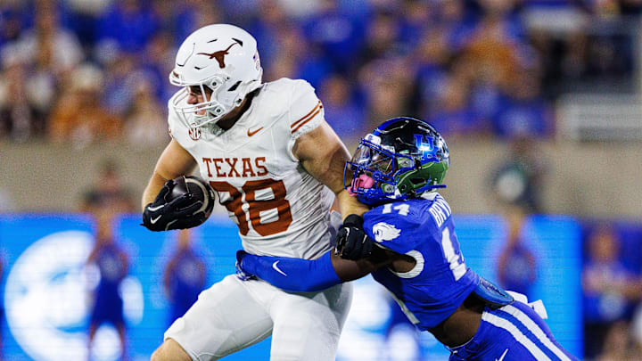 Texas Longhorns tight end Jack Endries is tackled by Kentucky Wildcats defensive back Ty Bryant.