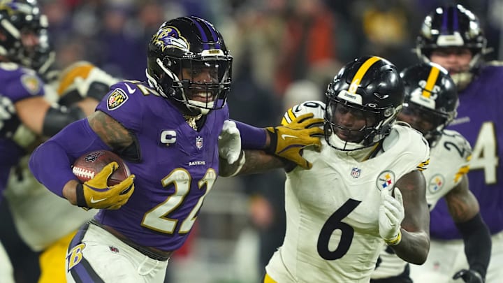 Jan 11, 2025; Baltimore, Maryland, USA; Baltimore Ravens running back Derrick Henry (22) runs to score a touchdown against Pittsburgh Steelers linebacker Patrick Queen (6) in the third quarter in an AFC wild card game at M&T Bank Stadium. Mandatory Credit: Mitch Stringer-Imagn Images