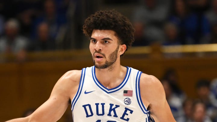 Feb 16, 2026; Durham, North Carolina, USA;  Duke Blue Devils forward Cameron Boozer (12) celebrates with Duke Blue Devils center Patrick Ngongba II (21) during the during the second half against the Syracuse Orange at Cameron Indoor Stadium. Mandatory Credit: Zachary Taft-Imagn Images