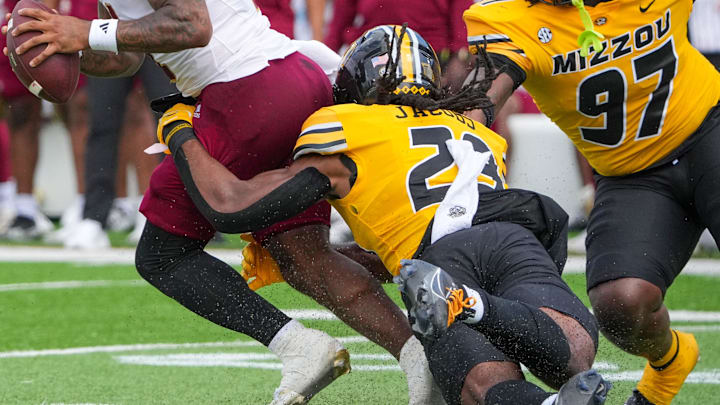 Sep 14, 2024; Columbia, Missouri, USA; Boston College Eagles quarterback Thomas Castellanos (1) is sacked by Missouri Tigers linebacker Khalil Jacobs (29) during the second half at Faurot Field at Memorial Stadium. Mandatory Credit: Denny Medley-Imagn Images