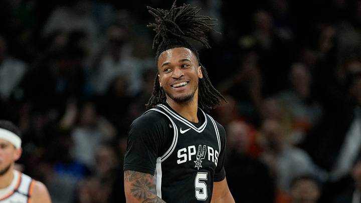 Feb 20, 2025; Austin, Texas, USA; San Antonio Spurs guard Stephon Castle (5) reacts after dunking during the first half against the Phoenix Suns at Moody Center. Mandatory Credit: Scott Wachter-Imagn Images