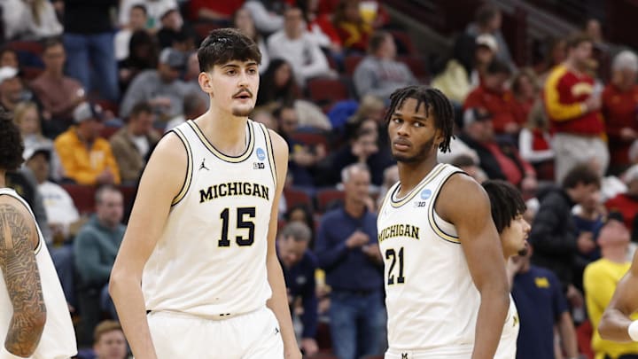 Mar 27, 2026; Chicago, IL, USA; Michigan Wolverines center Aday Mara (15) and forward Morez Johnson Jr. (21) look on during the first half against the Alabama Crimson Tide during a Sweet Sixteen game of the Midwest Regional of the men's 2026 NCAA Tournament at United Center. Mandatory Credit: Kamil Krzaczynski-Imagn Images
